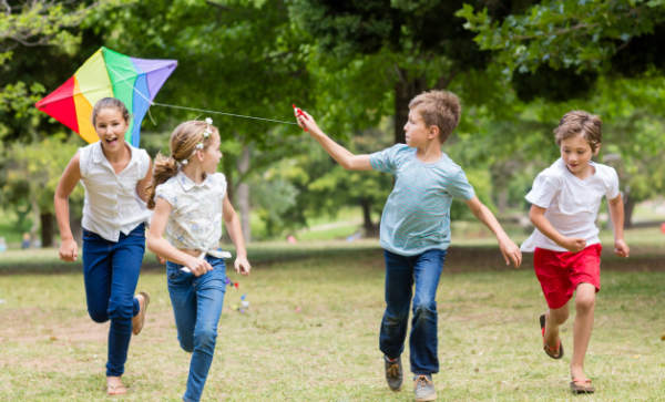 kids playing with a kite