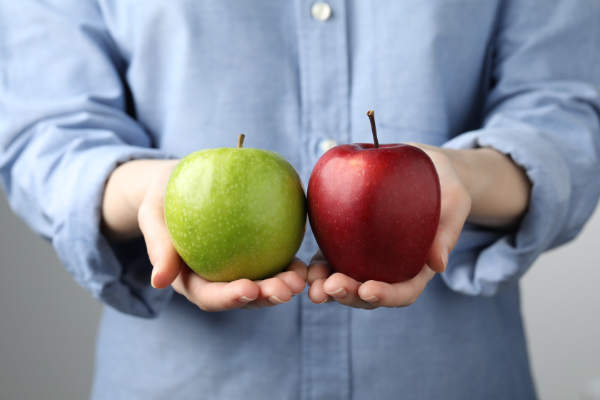 woman holding apples
